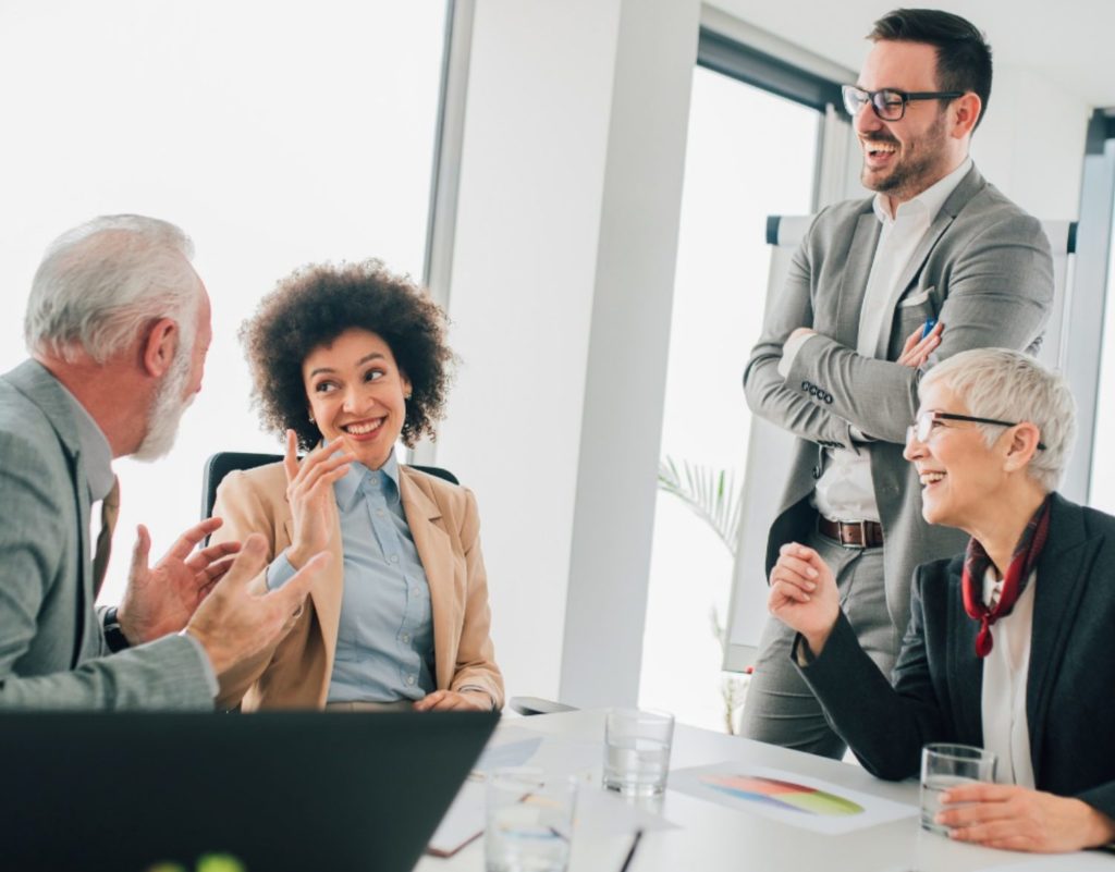 Investment fund managers in a meeting discussing the best marketing strategies for a client with Capital Velocity.